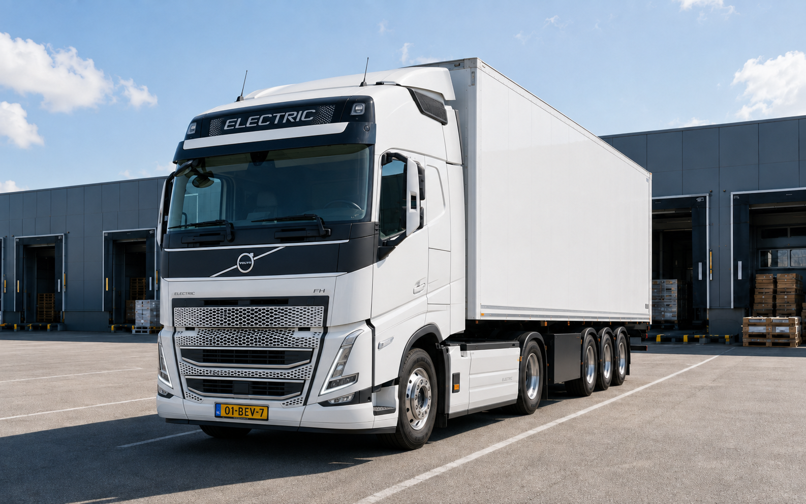 A battery-electric heavy truck at a modern logistics depot